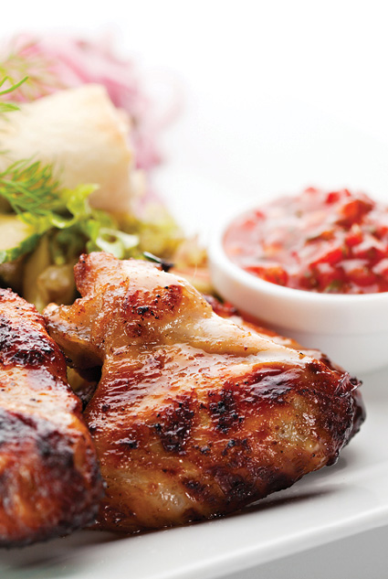 chicken wings with a side of piri-piri sauce